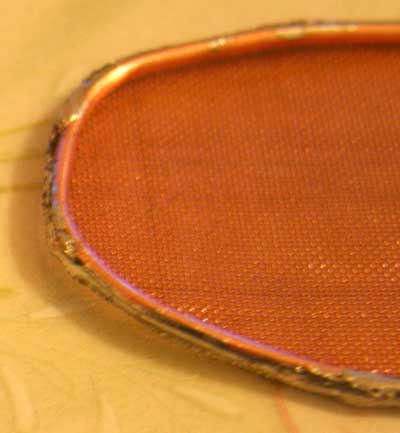 Mesh soldered to rim